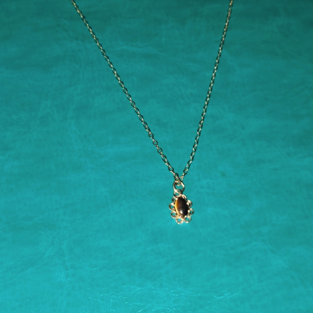 Tigers eye 1/20 14k G.F., a 925 solid silver ring.